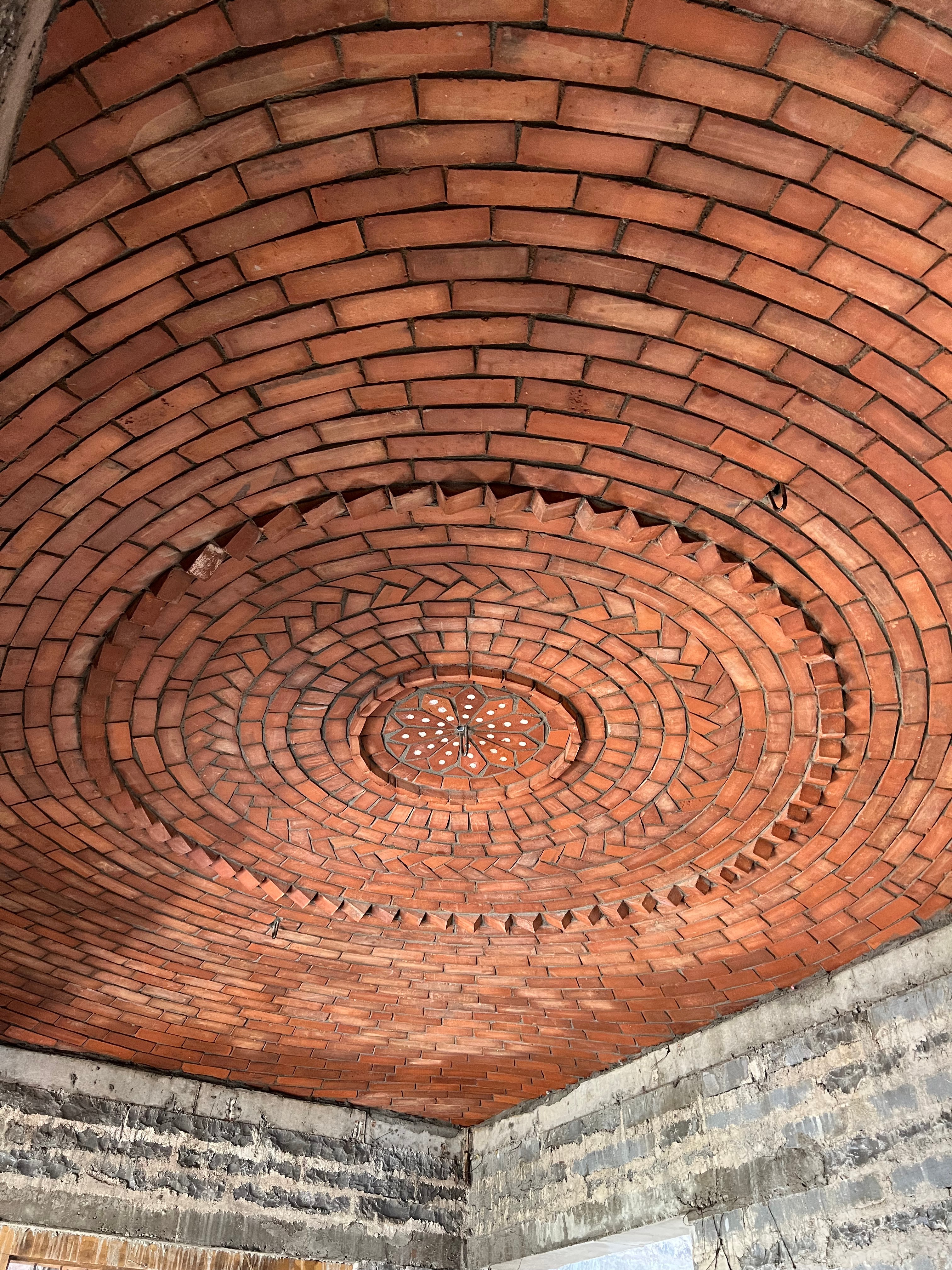 Finished dome ceiling with intricate brick pattern and center detail - Rohtak Domes 2025